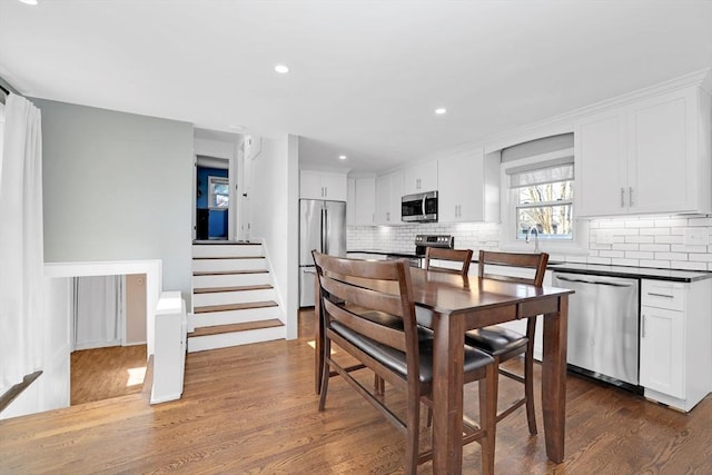 110 Walnut St, Canton, MA 02021 - dining area featuring dark wood-style floors, recessed lighting, and stairway