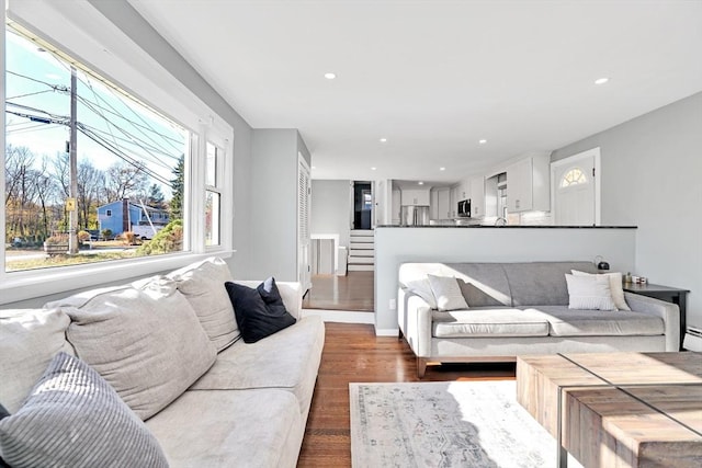 110 Walnut St, Canton, MA 02021 - living room with dark wood-type flooring, recessed lighting, and stairway