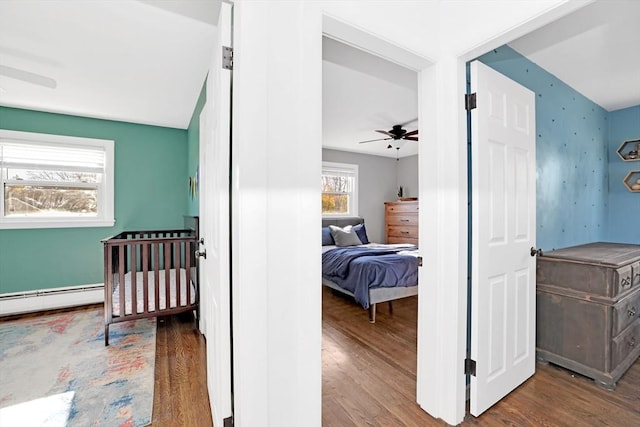 110 Walnut St, Canton, MA 02021 - bedroom featuring wood finished floors and baseboard heating