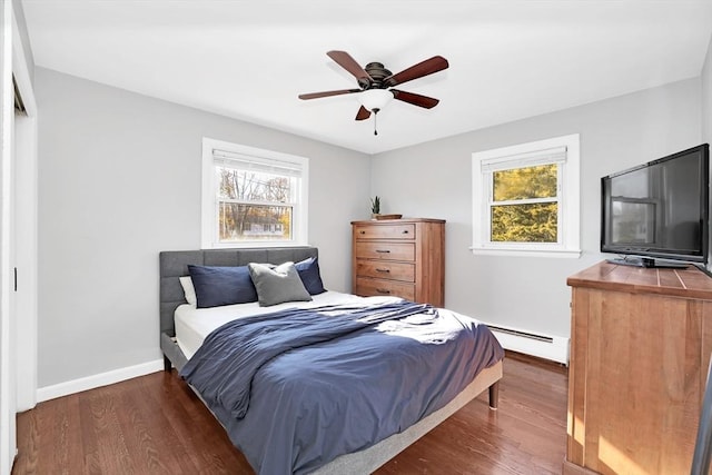 110 Walnut St, Canton, MA 02021 - bedroom featuring wood finished floors, a baseboard radiator, baseboards, and a ceiling fan