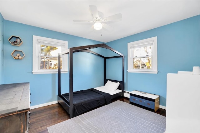 110 Walnut St, Canton, MA 02021 - bedroom with wood finished floors, baseboards, a ceiling fan, and baseboard heating