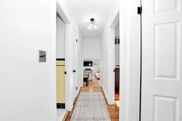 110 Walnut St, Canton, MA 02021 - hall with light wood-style flooring and baseboards