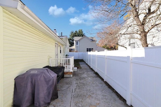 110 Walnut St, Canton, MA 02021 - view of home's exterior featuring a fenced backyard and a patio area