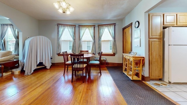 25 Garrison St, Fairhaven, MA 02719 - dining area with light wood-type flooring and arched walkways