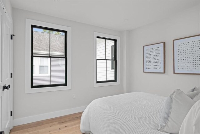 bedroom with light hardwood / wood-style floors