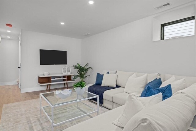 living room with light hardwood / wood-style floors