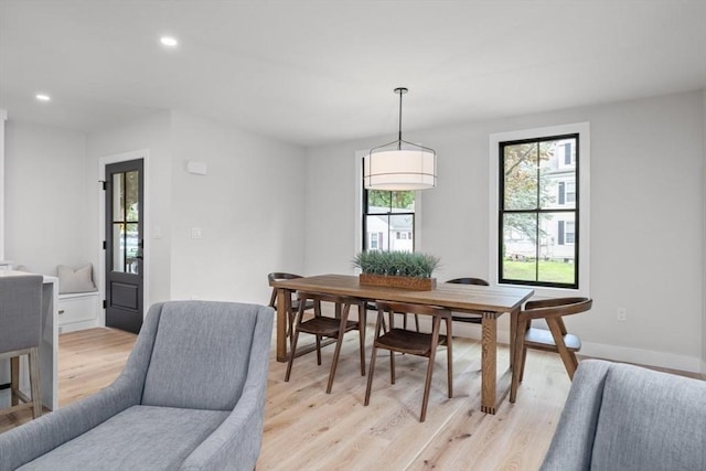 dining space with light wood-type flooring