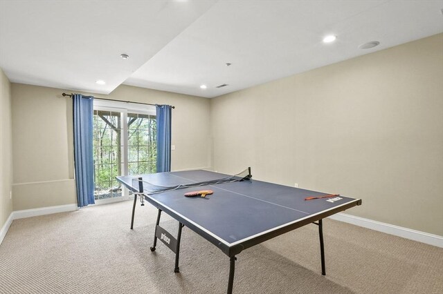 rec room featuring recessed lighting, baseboards, and light carpet