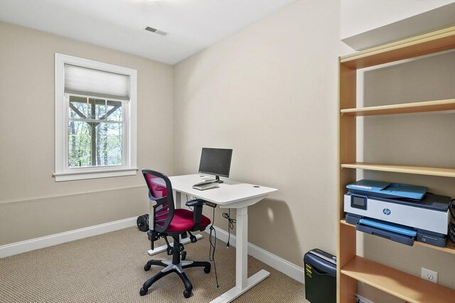 office area featuring baseboards, carpet flooring, and visible vents