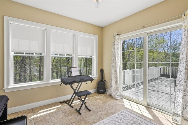 interior space featuring baseboards and tile patterned flooring