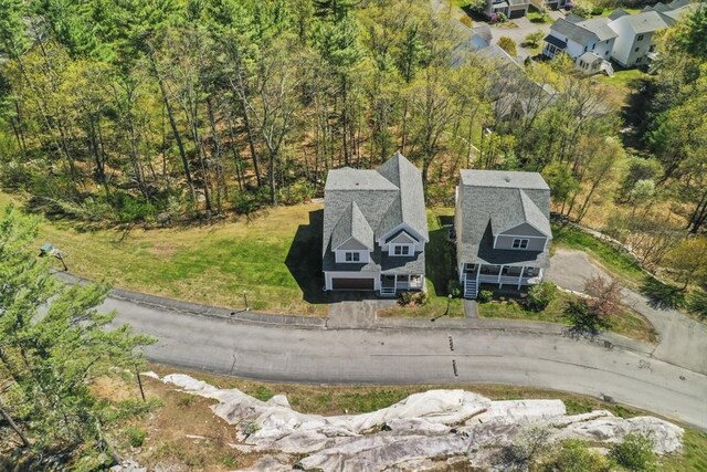 aerial view with a wooded view