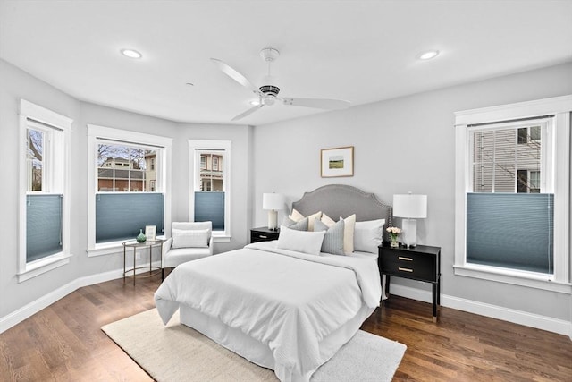 bedroom with ceiling fan and dark wood-type flooring