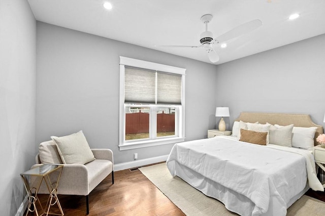 bedroom featuring ceiling fan and wood-type flooring