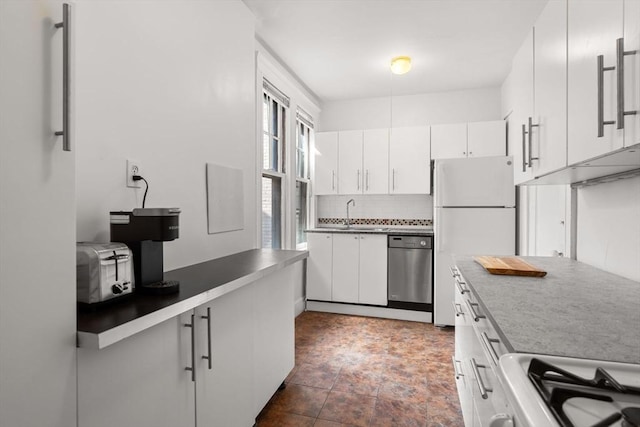 32 Sidlaw Rd Unit 14, Boston, MA 02135 - kitchen with freestanding refrigerator, tasteful backsplash, dishwasher, stove, and white cabinets