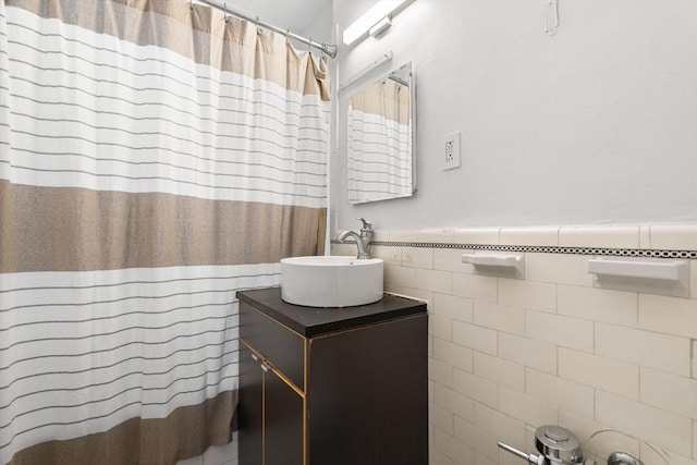 32 Sidlaw Rd Unit 14, Boston, MA 02135 - bathroom with tile walls, vanity, a wainscoted wall, and a shower with shower curtain