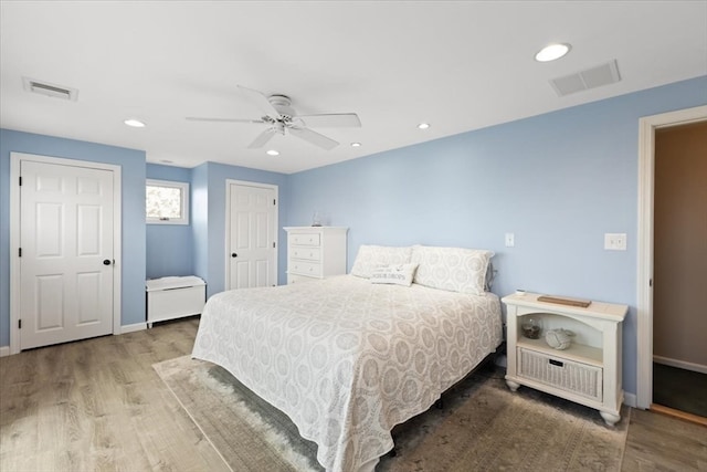 bedroom featuring hardwood / wood-style flooring and ceiling fan