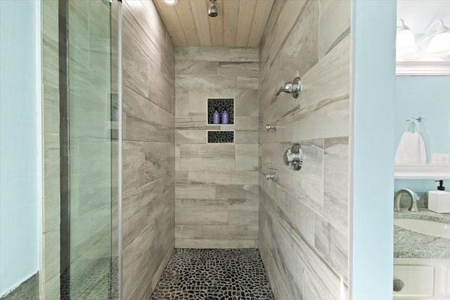 bathroom featuring sink and tiled shower