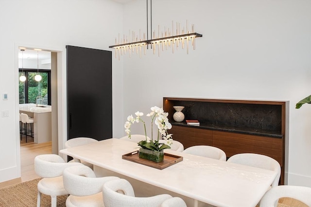 dining area with wood finished floors