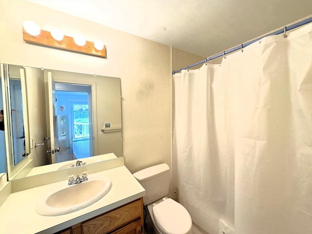 101 Fletcher Unit K, Brewster, MA 02631 - full bathroom with toilet, vanity, and a shower with shower curtain