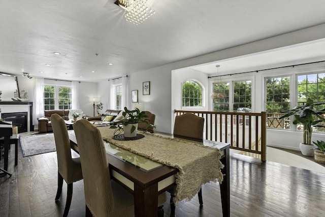 12 Paul Revere Path Unit 12, Hopkinton, MA 01748 - dining room featuring wood finished floors, a glass covered fireplace, and recessed lighting
