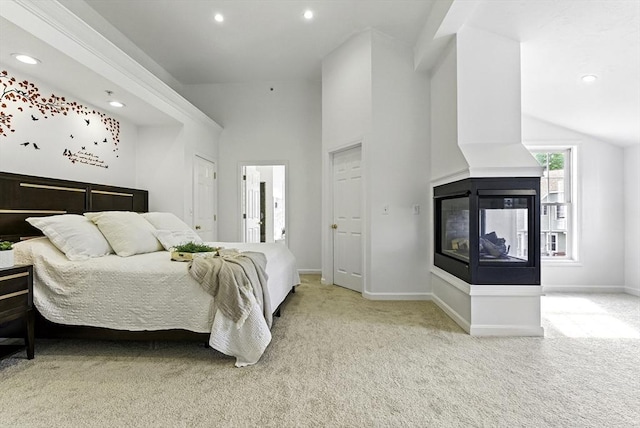 12 Paul Revere Path Unit 12, Hopkinton, MA 01748 - bedroom featuring carpet floors, recessed lighting, baseboards, a multi sided fireplace, and lofted ceiling