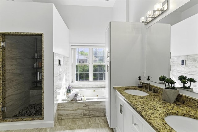 12 Paul Revere Path Unit 12, Hopkinton, MA 01748 - bathroom with a whirlpool tub, a shower stall, marble finish flooring, and double vanity
