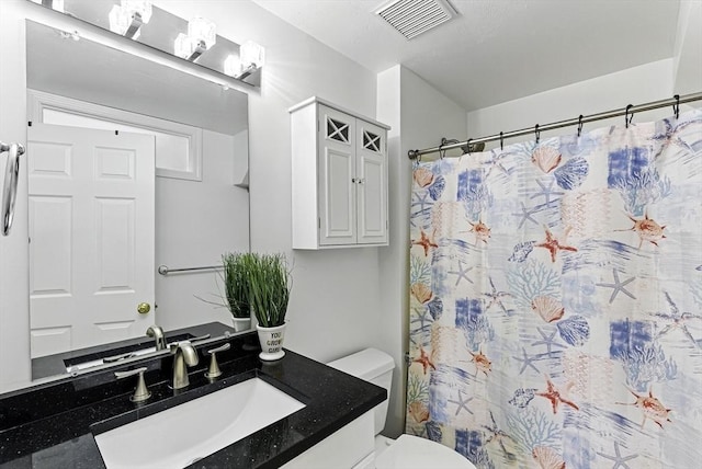 12 Paul Revere Path Unit 12, Hopkinton, MA 01748 - bathroom with toilet, vanity, and curtained shower