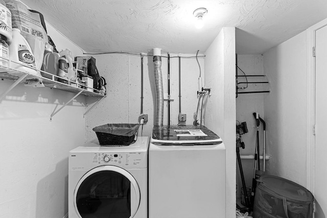 12 Paul Revere Path Unit 12, Hopkinton, MA 01748 - clothes washing area featuring separate washer and dryer and a textured ceiling
