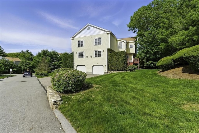12 Paul Revere Path Unit 12, Hopkinton, MA 01748 - view of property exterior with an attached garage and a lawn