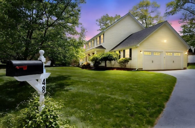 48 Logans Run, Attleboro, MA 02703 - view of front facade featuring a yard, driveway, and a garage