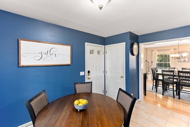 48 Logans Run, Attleboro, MA 02703 - dining area with a chandelier and a baseboard radiator