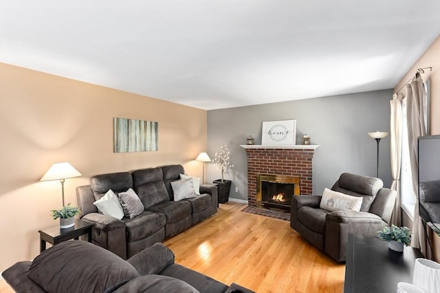 48 Logans Run, Attleboro, MA 02703 - living room with light wood-style floors, a fireplace, and baseboards