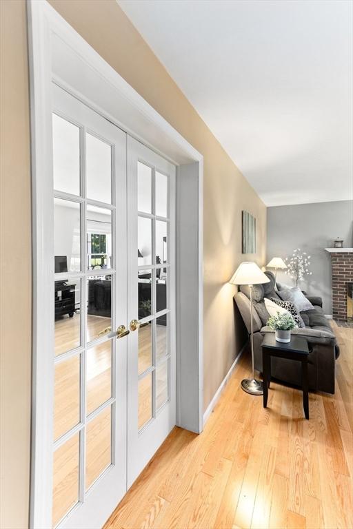 48 Logans Run, Attleboro, MA 02703 - living room featuring french doors, light wood-type flooring, and baseboards