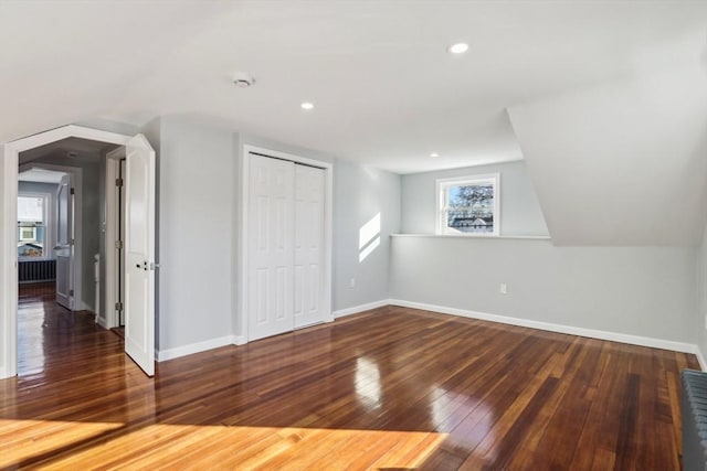 bonus room featuring dark wood-type flooring