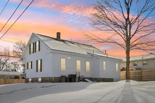 view of snow covered property