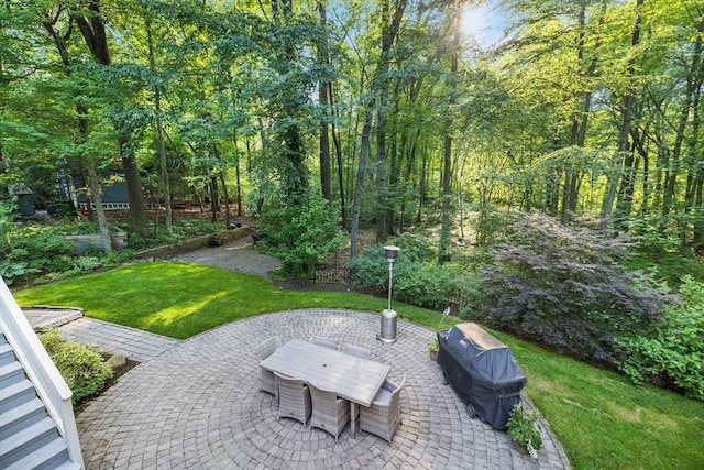 39 Blueberry Ln, Hopkinton, MA 01748 - view of patio with outdoor dining space and a wooded view