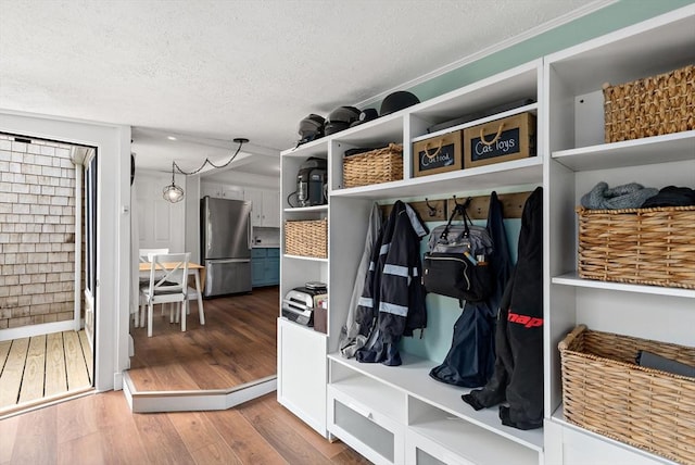 100 Elm St, Marshfield, MA 02050 - mudroom featuring a textured ceiling and wood finished floors