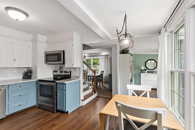 100 Elm St, Marshfield, MA 02050 - kitchen with appliances with stainless steel finishes, blue cabinetry, dark wood-type flooring, white cabinetry, and light countertops