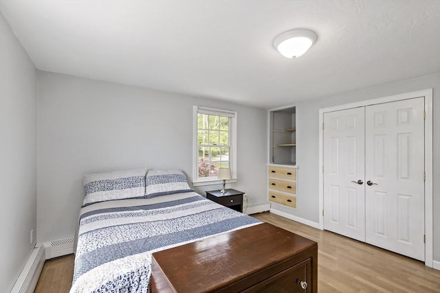 100 Elm St, Marshfield, MA 02050 - bedroom featuring light wood finished floors, baseboard heating, and a closet
