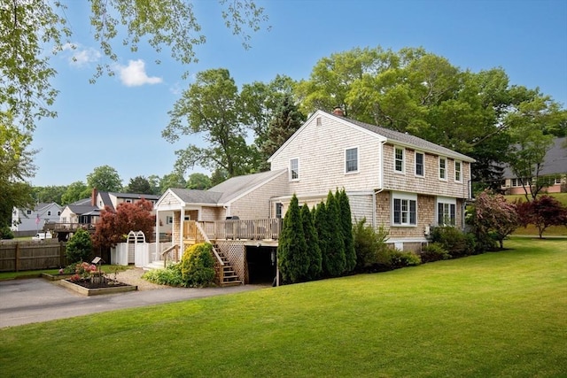 100 Elm St, Marshfield, MA 02050 - back of house featuring a deck, stairway, driveway, an attached garage, and a chimney