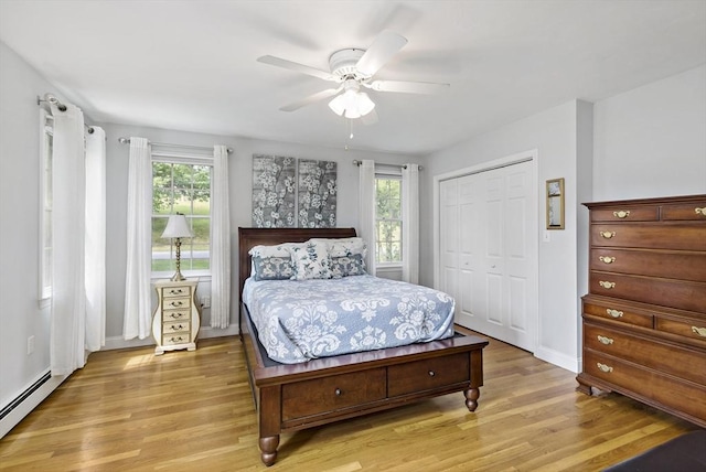 100 Elm St, Marshfield, MA 02050 - bedroom with baseboard heating, light wood-type flooring, a closet, and ceiling fan