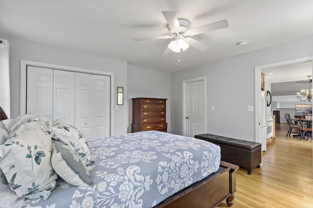 100 Elm St, Marshfield, MA 02050 - bedroom featuring a closet, light wood-style flooring, a chandelier, and a ceiling fan