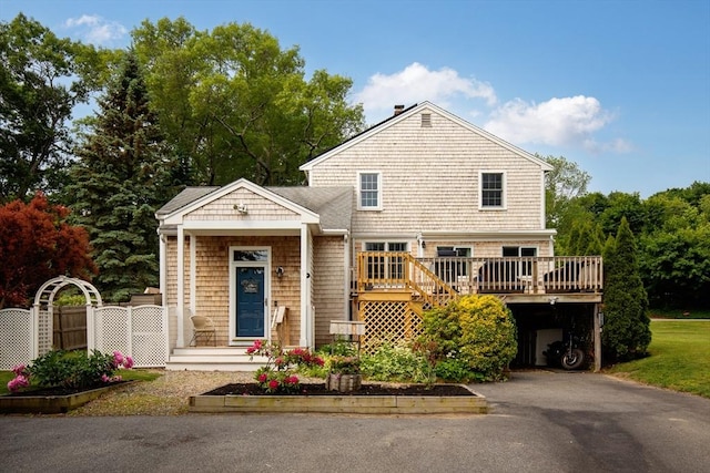 100 Elm St, Marshfield, MA 02050 - view of front of property featuring a wooden deck and asphalt driveway