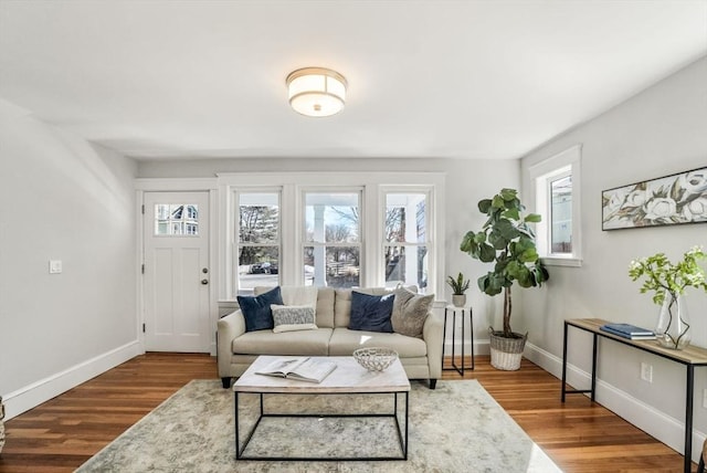 living area featuring wood finished floors and baseboards