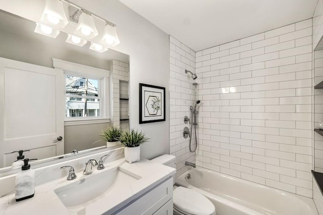 bathroom with toilet, vanity, and washtub / shower combination