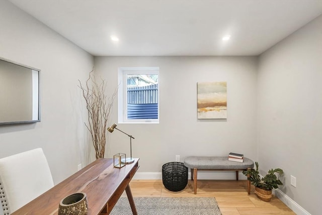 office featuring baseboards, wood finished floors, and recessed lighting