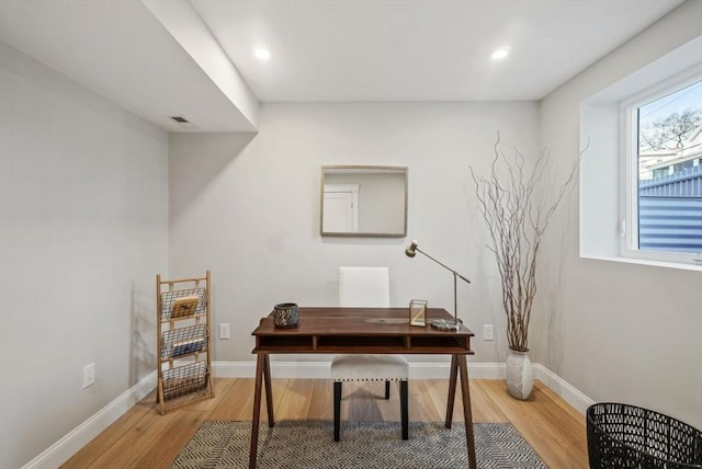 office area featuring light wood-style flooring, visible vents, baseboards, and recessed lighting