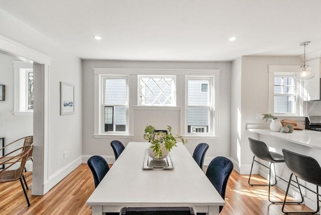 dining area featuring baseboards, recessed lighting, and light wood-style floors