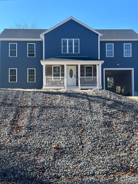 view of front of property featuring covered porch