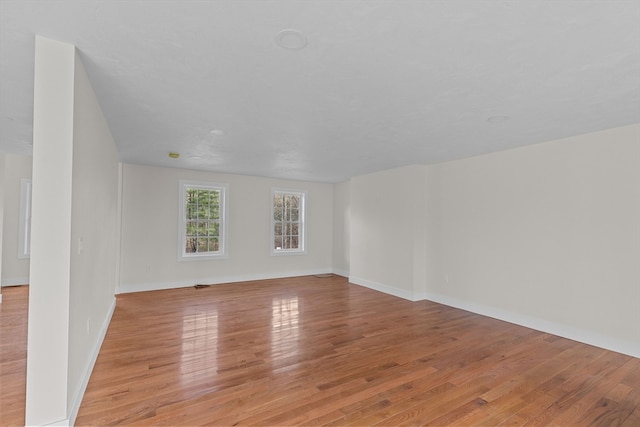 unfurnished room with light hardwood / wood-style flooring